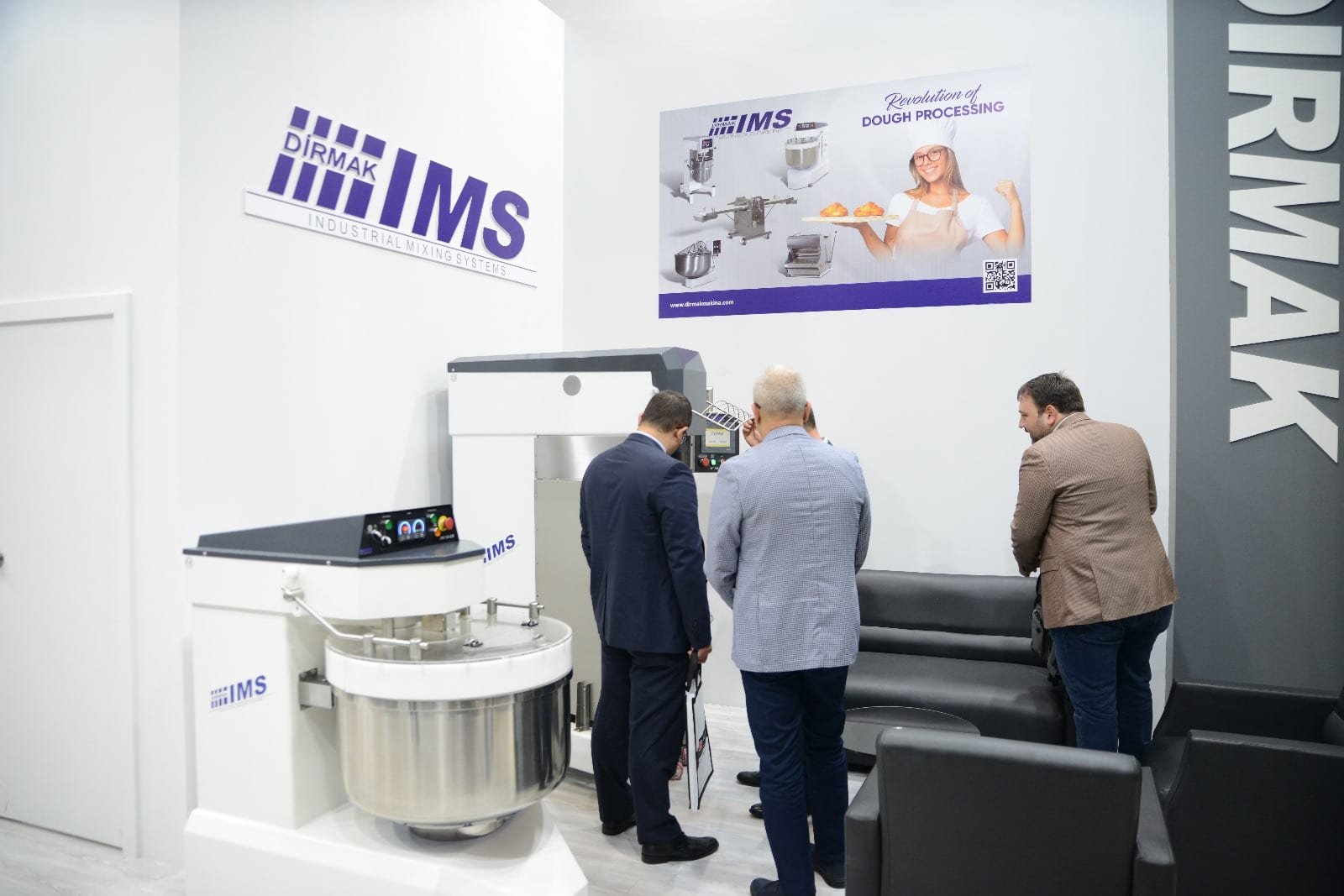 Dirmak Makina booth at a European bakery & pastry trade exhibition with the IBT 300-VEL industrial planetary mixer on display.