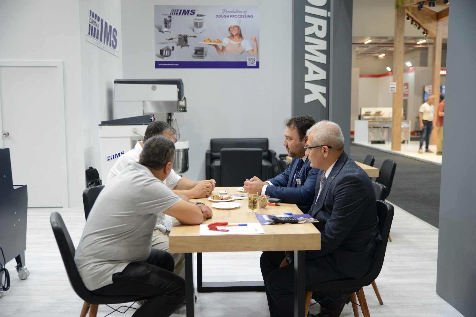 Meeting at the Dirmak IMS booth with a planetary mixer in view