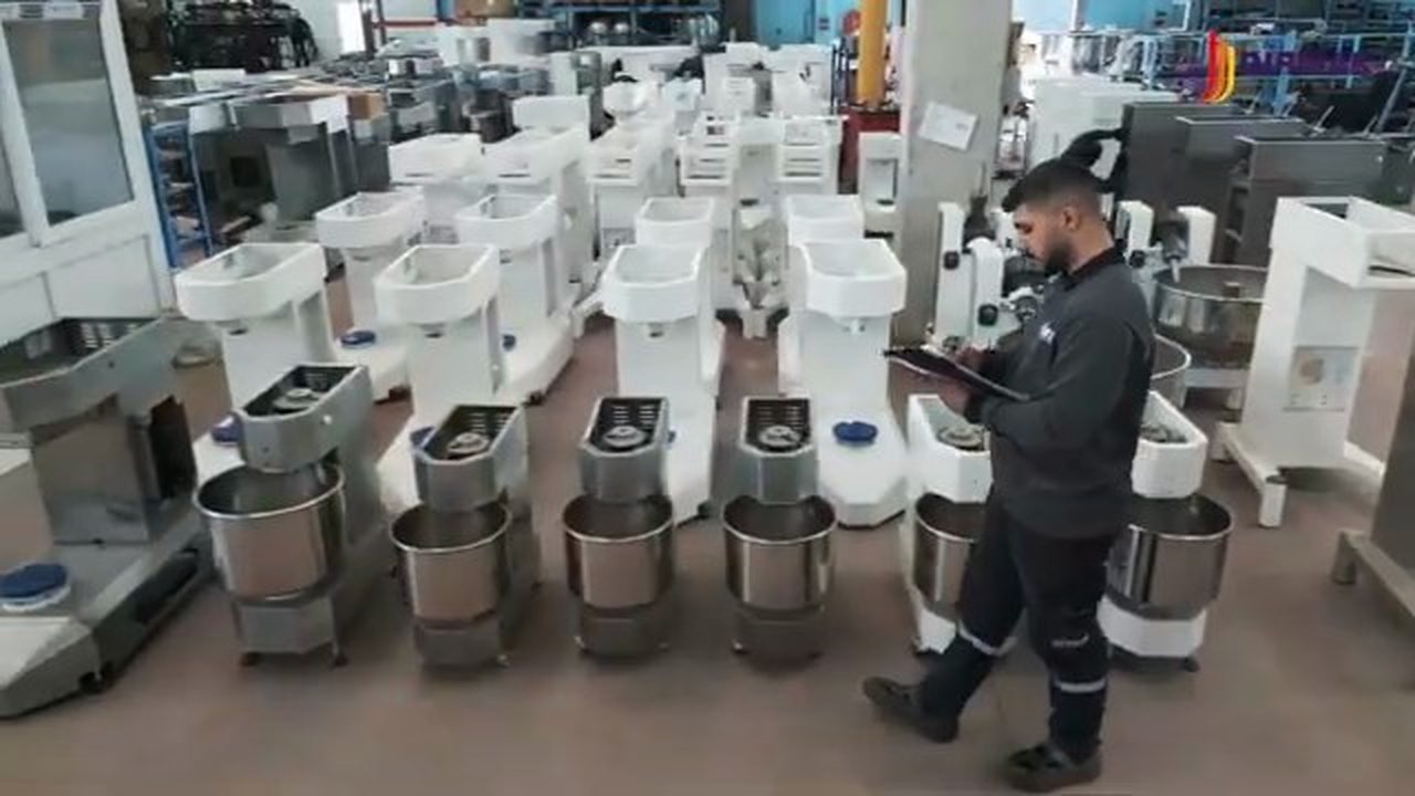 Rows of finished Dirmak Makina mixers in the İzmir showroom — assembly and quality-control completed, ready for shipping